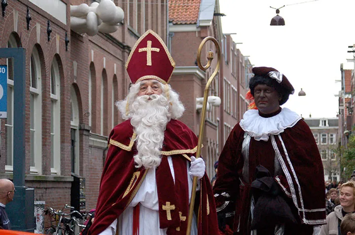 Persons wearing outfits and celebrating Sinterklaas