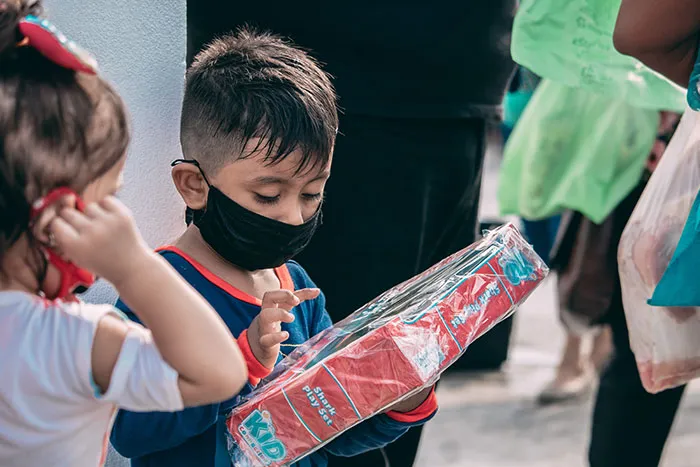 Kids looking and holding gift