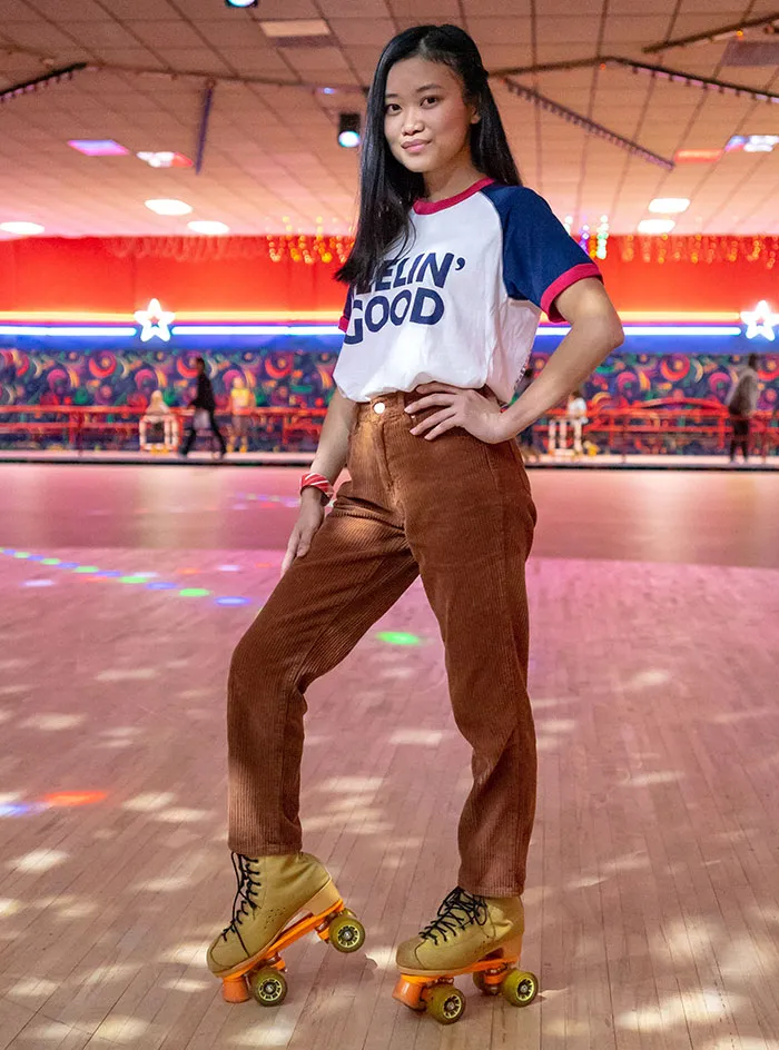 Person standing and wearing roller skates