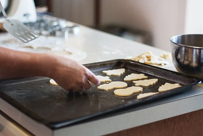 Person making Christmas cookies