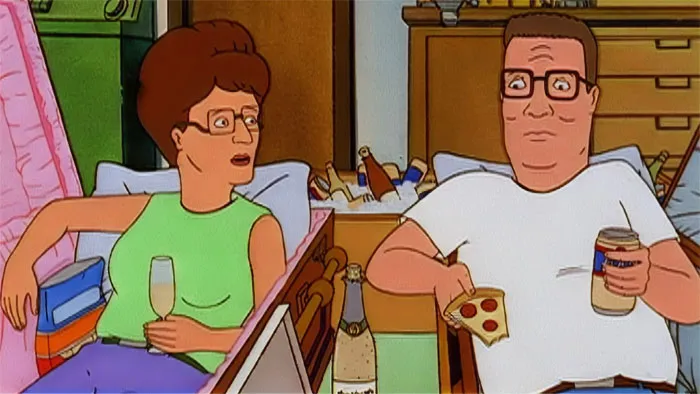Cartoon couple enjoying pizza and drinks on the couch in a cozy setting, showcasing love sweeter than sugar.