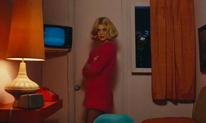 Jane wearing pink sweater 