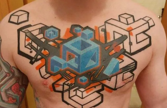 Trippy mosaic chest tattoo with geometric patterns and vibrant colors.