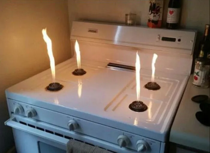 What It Looks Like When You Take The Metal Tops Off Of Gas Stove Burners