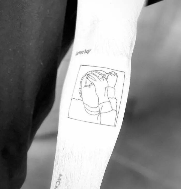 Minimalist tattoo with a line drawing of a person covering their face, showcasing a simple and aesthetic design.