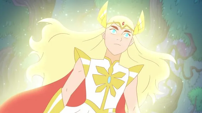 Powerful female cartoon character with flowing blonde hair, glowing in a forest setting.