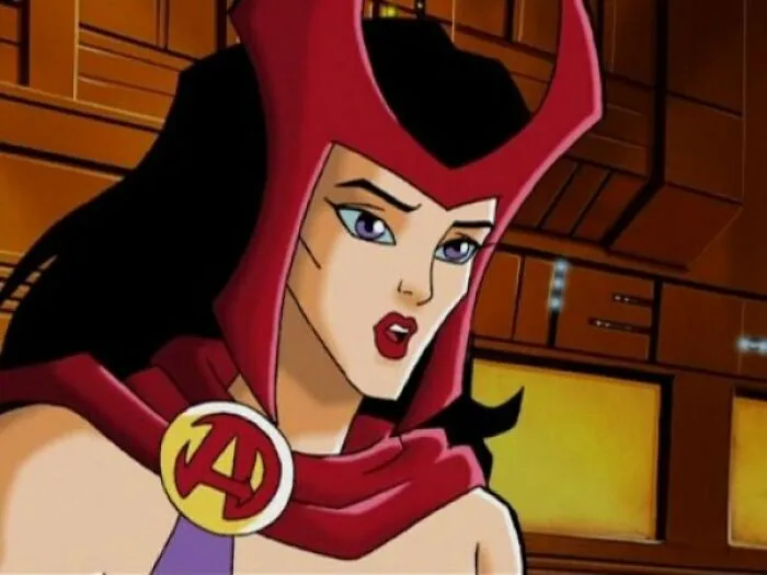 Female cartoon character in a red cape and headpiece, showcasing fame and strength.