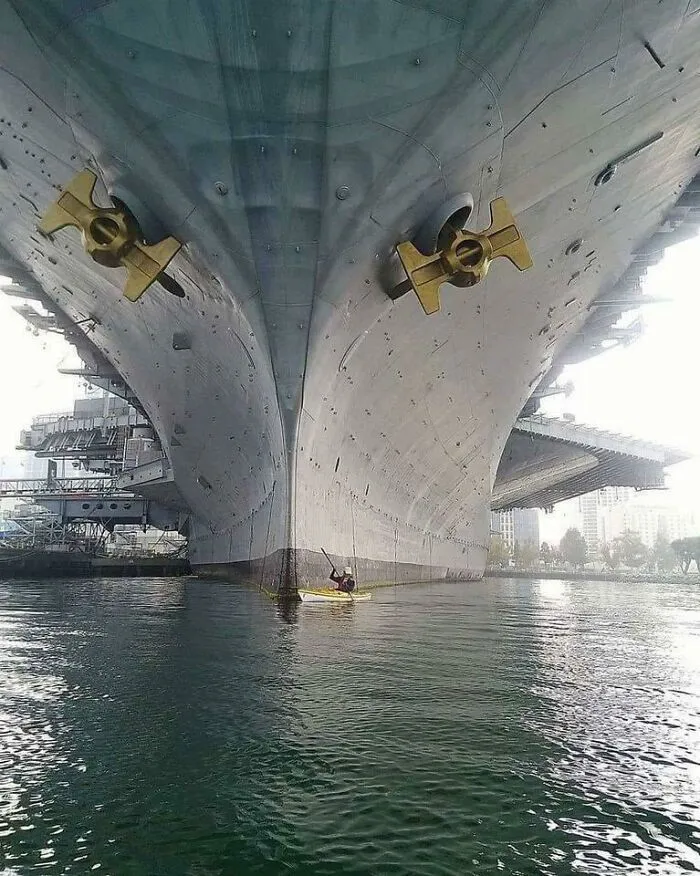 Canoe Next To Uss Midway