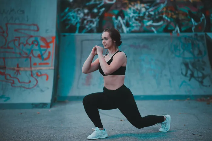 Woman doing exercises in a skate park 