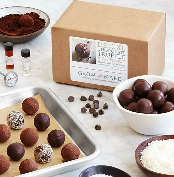 Deluxe chocolate truffle making kit with ingredients and finished truffles, perfect Valentine's Day gift for love and affection.