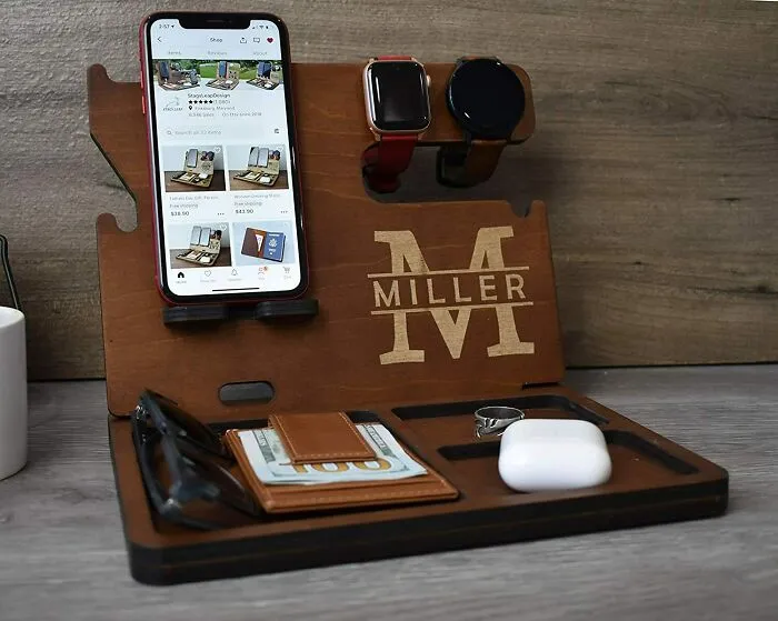 Personalized wooden organizer with phone, watch, and accessory slots; perfect Valentine's Day gift idea.