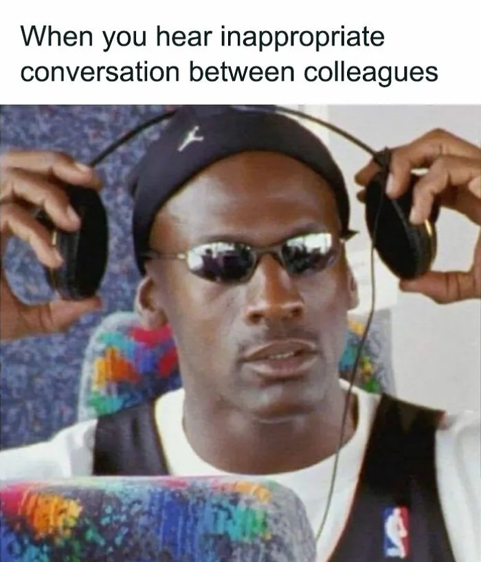 A person wearing sunglasses and headphones, reacting humorously to an inappropriate work conversation. 