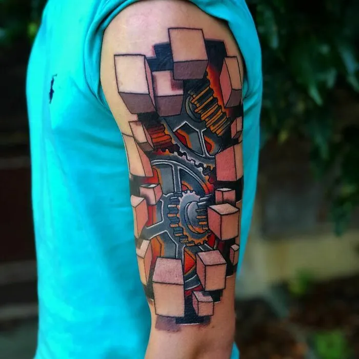 Optical illusion tattoo design on an arm featuring gears and 3D cubes, creating a mind-bending visual effect.