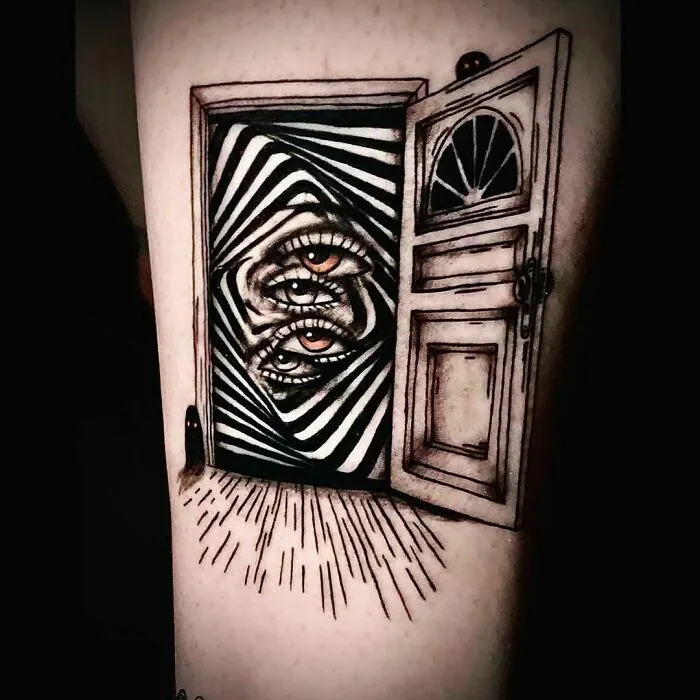 Optical illusion tattoo featuring a door with eyes and mind-bending designs.