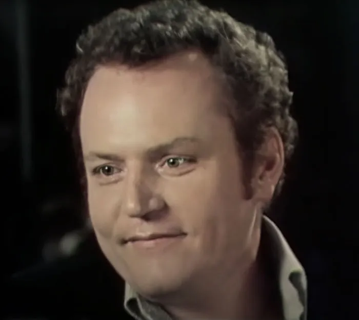 Larry Flynt smiling in a close-up portrait, known among famous people who got married multiple times.