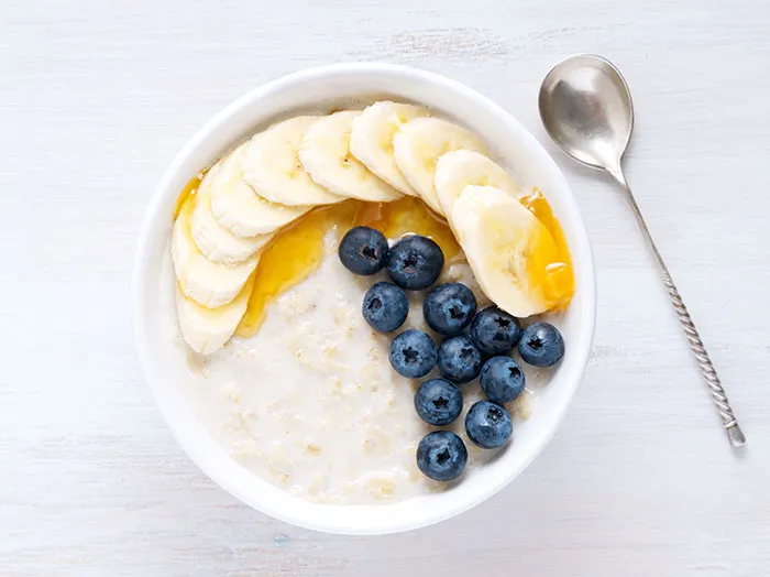 Oatmeal With Banana, Berries And Spices Like Cinnamon, Ginger, Salt, Maybe Some Cocoa Powder