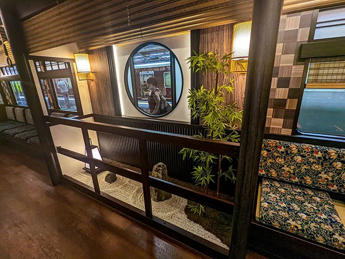 Mini Japanese Garden Between Seats On A Train To Kyoto