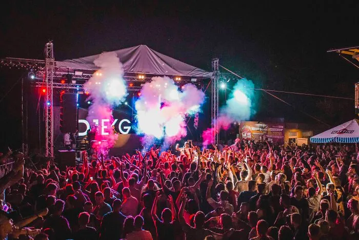 Stage In A Music Festival With Hundreds Of People 