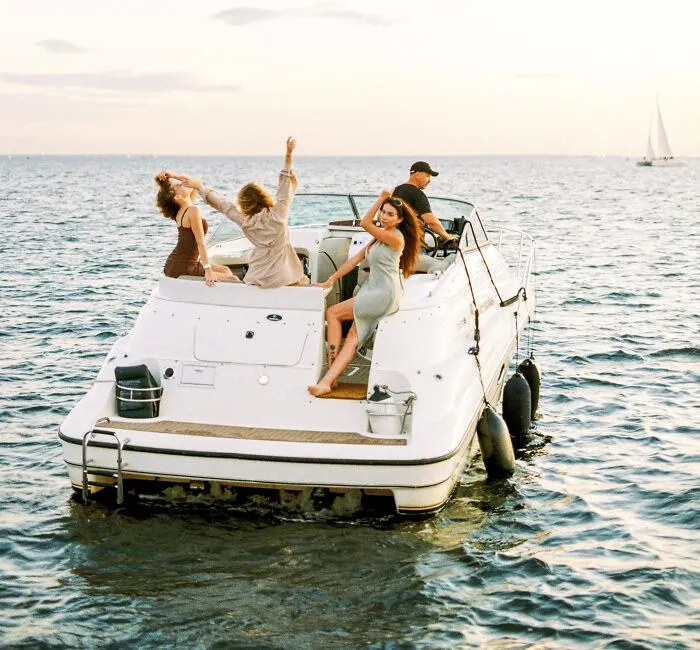 Group Of Friends On A Boat In The Ocean 
