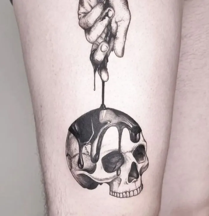 Intricate trippy tattoo of a skull with melting wax, captured on an arm.