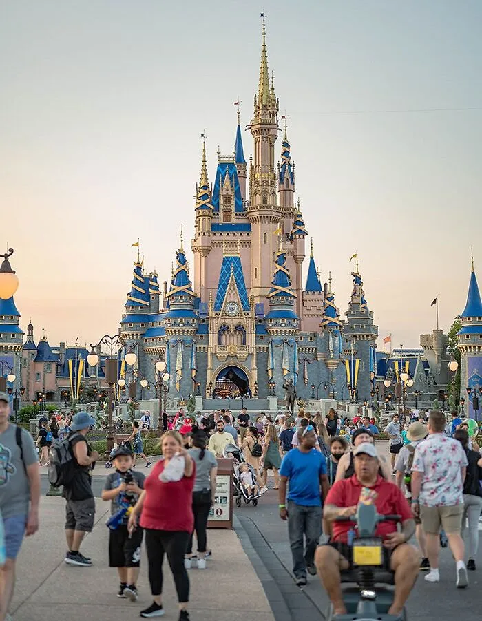 People walking near the castle in Disneyland