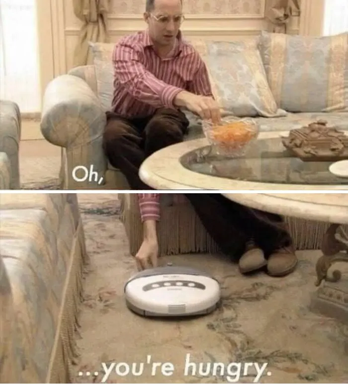 Person feeding a Roomba, referencing a meme that humorously exaggerates interactions best discussed in therapy.