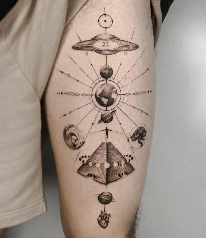 Intricate geometric tattoo design with shapes and creative forms on a person's thigh.