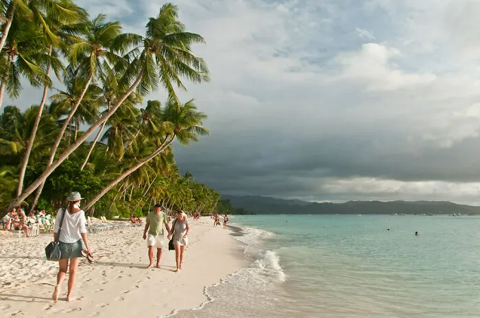 People walking at the beach in Boracay Island