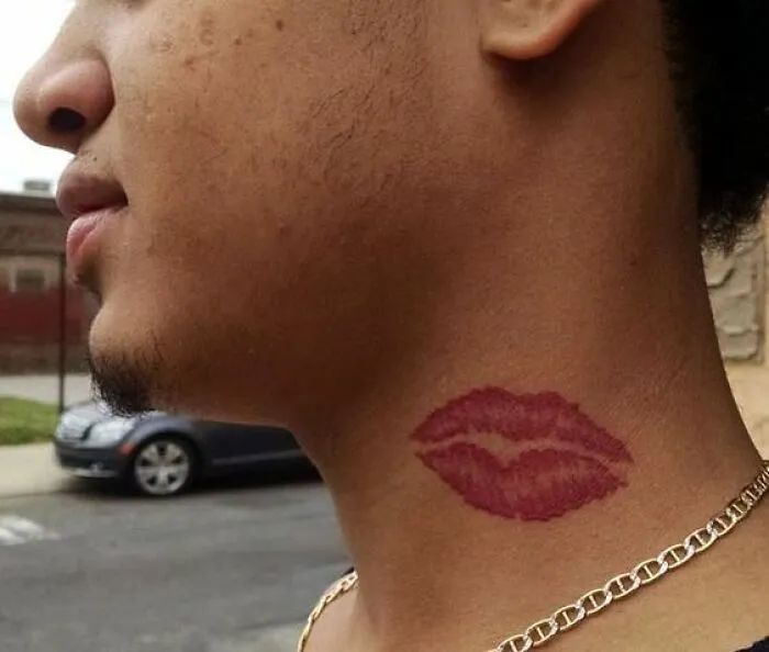 Tattoo of red lipstick mark on someone's neck, featuring cringe-worthy tattoo type discussion.