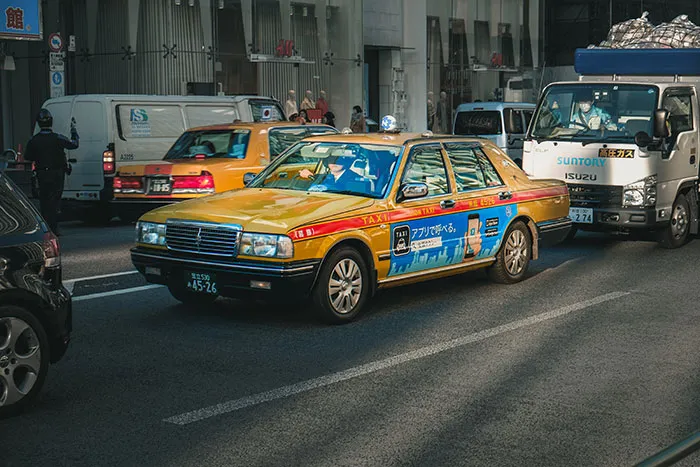 Yellow taxi car in traffic