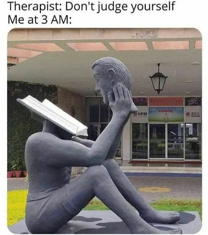 A sculpture of a person holding their head, with a book as a face, humorously illustrating a self-judging meme.