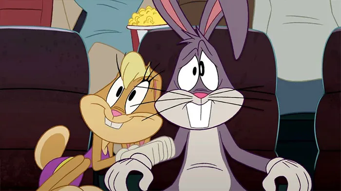 Cartoon couple enjoying a movie together, with popcorn in the background, showcasing sweet love dynamics.