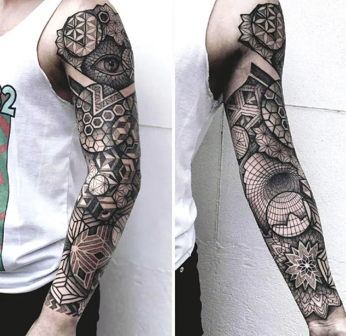 Arm with intricate geometric tattoo designs featuring shapes and forms, emphasizing creativity.