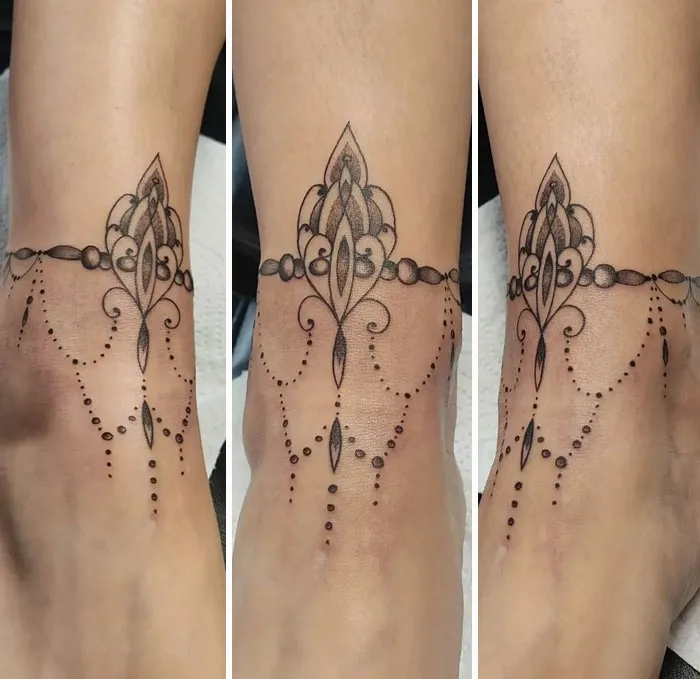 Geometric tattoo design on ankle, showcasing intricate shapes and forms creatively.