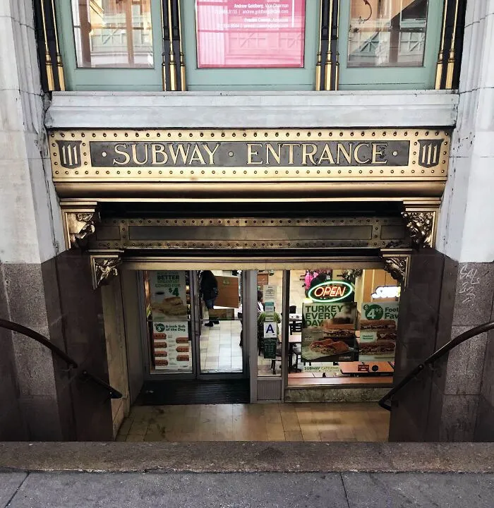 Subway entrance converted into a restaurant, showcasing creative building conversions.