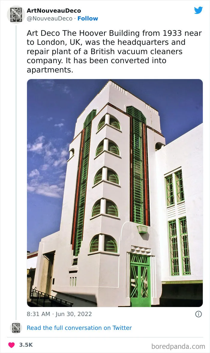 Art Deco Hoover Building converted into modern apartments with green accents under a blue sky.