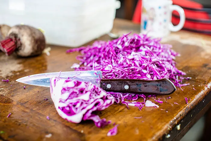 Purple cabbage on wooden table 