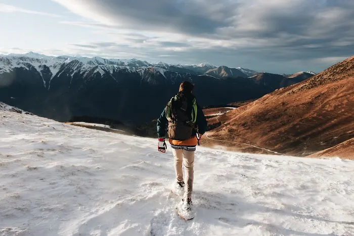 man going on a snowy hill