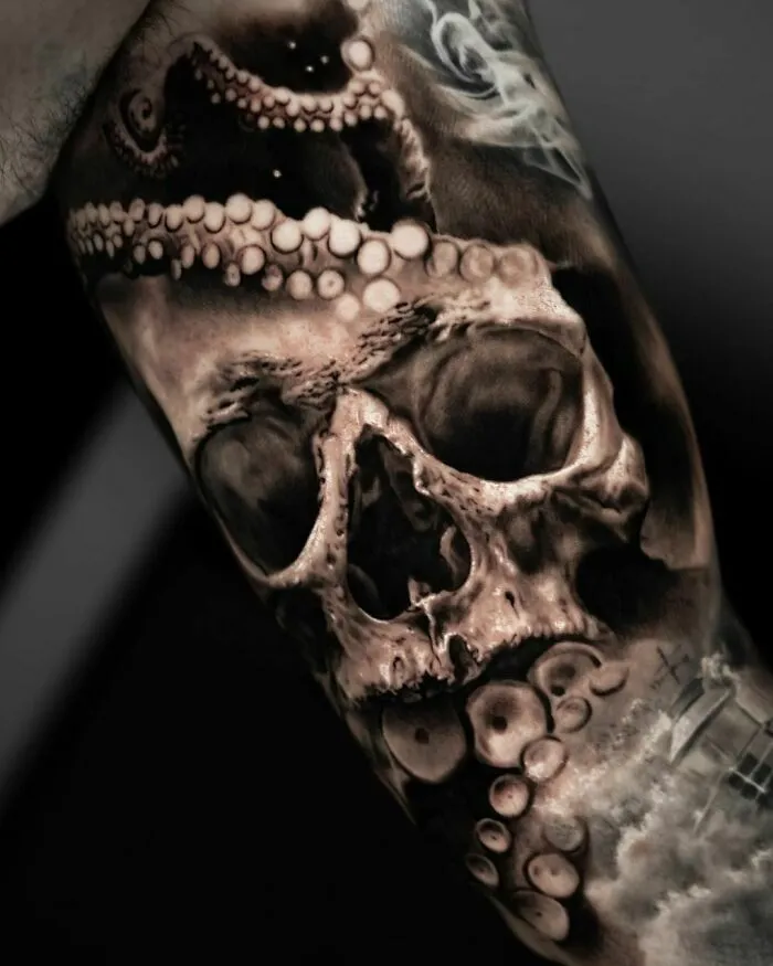Realistic tattoo of a nautical skull entwined with detailed octopus tentacles.