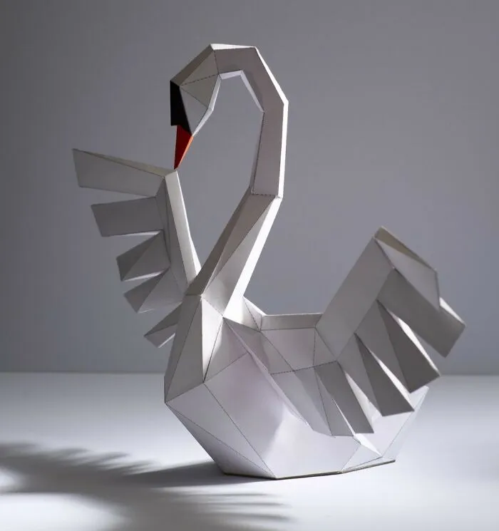 a white swan made out of a paper