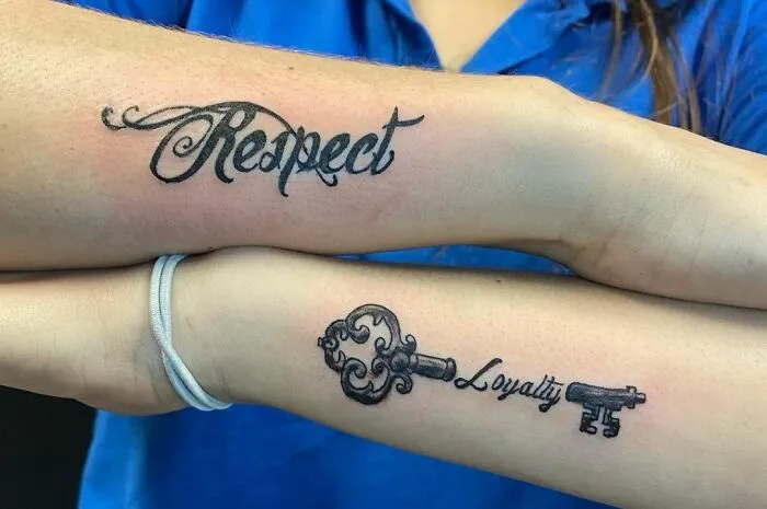 Word tattoos of "Respect" and "Loyalty" on forearms, featuring creative ink designs.