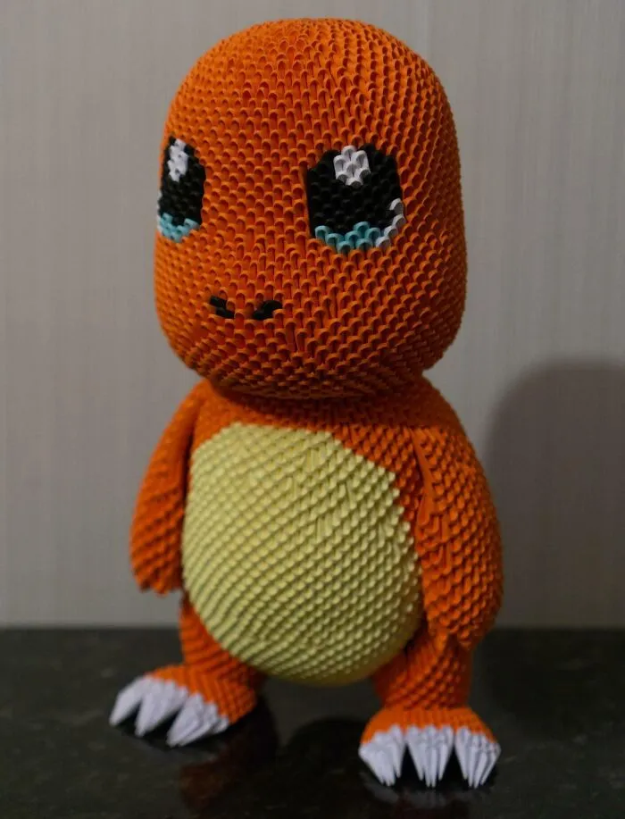 an orange 3D origami charmander