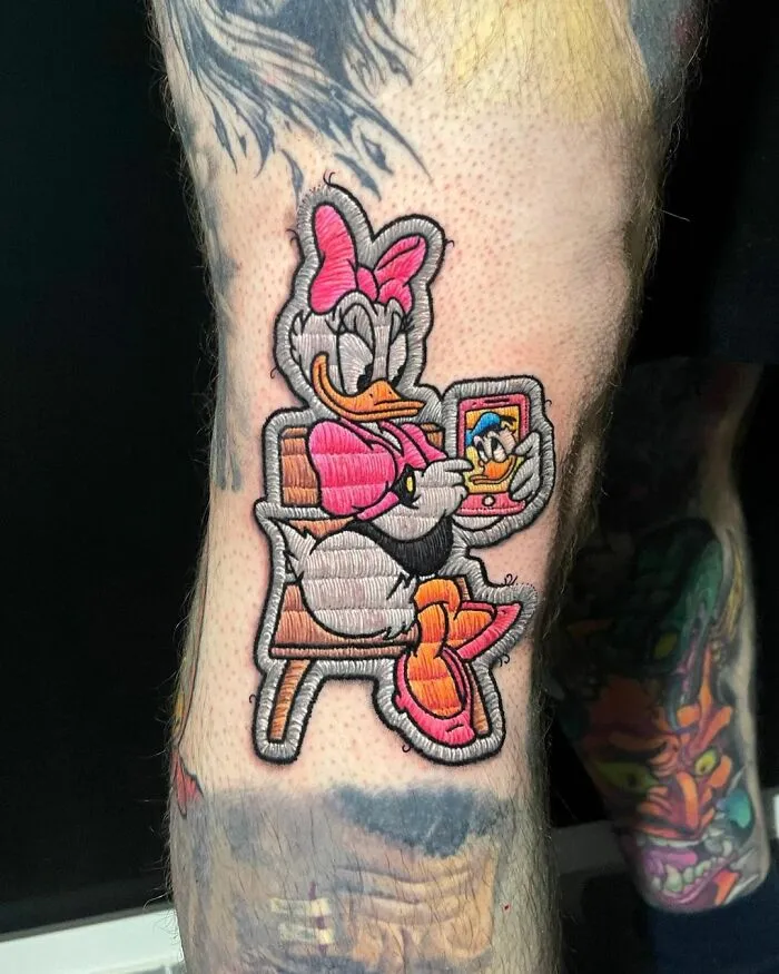 Tattoo by Eduardo Lozano, showcasing a colorful cartoon character in new tattooing dimension style.