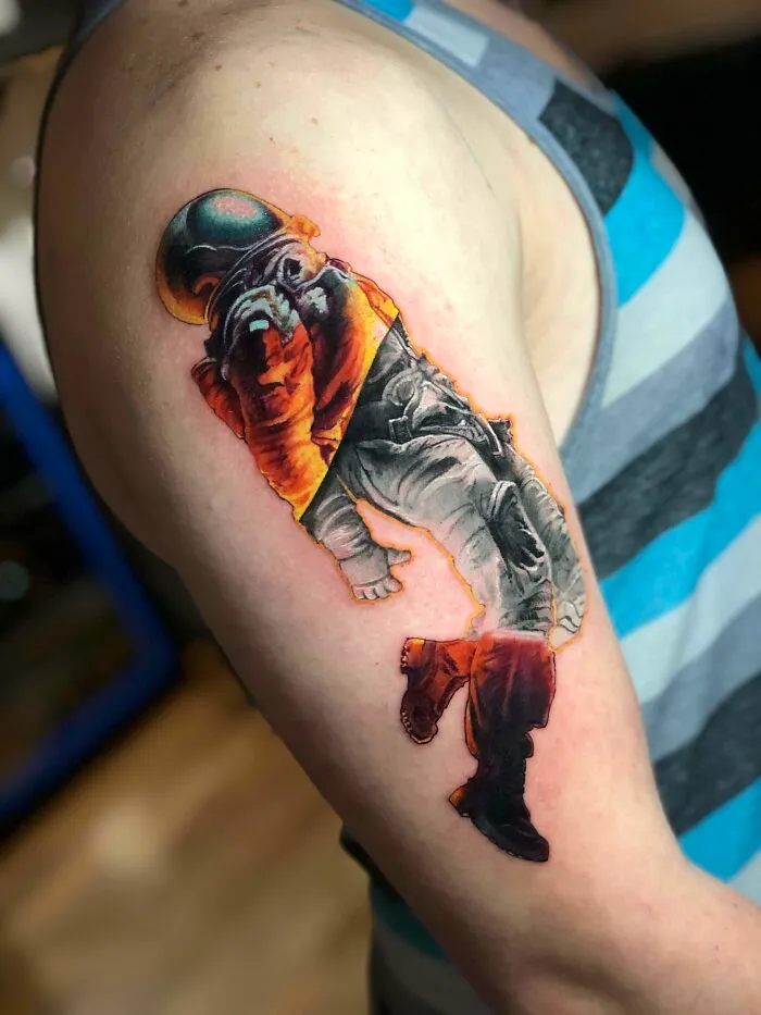 Astronaut Arm Tattoo