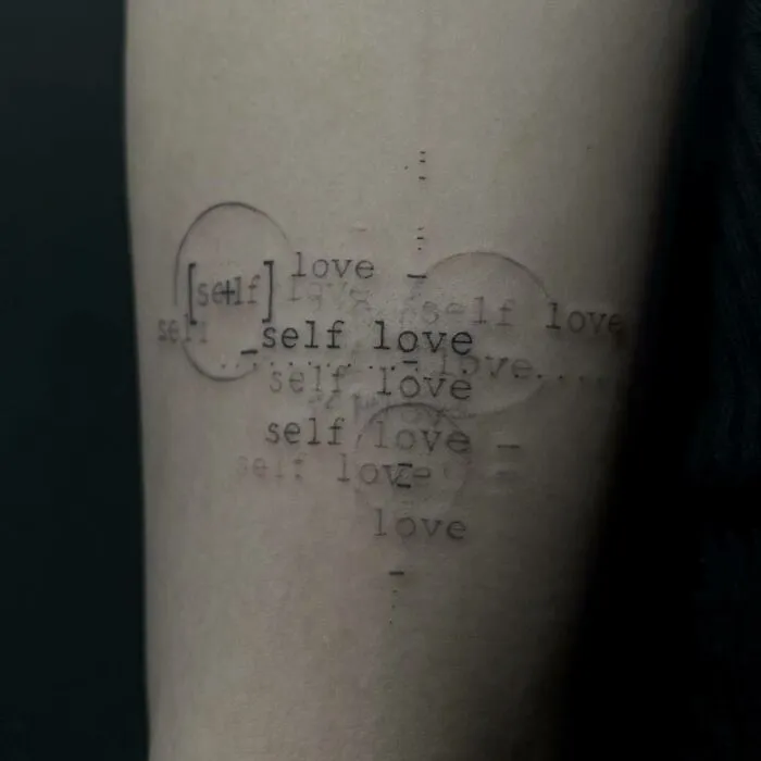 Overlapping “Self Love” Lettering Tattoo