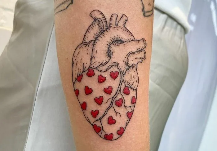 Tattoo of Realistic Heart with Hearts Symbols