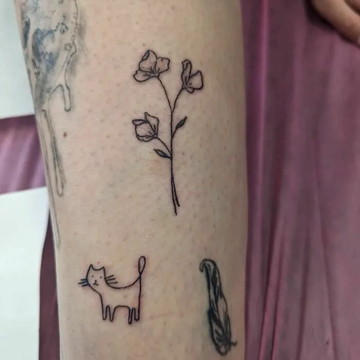 Simple flower tattoo on arm radiates elegance and beauty.