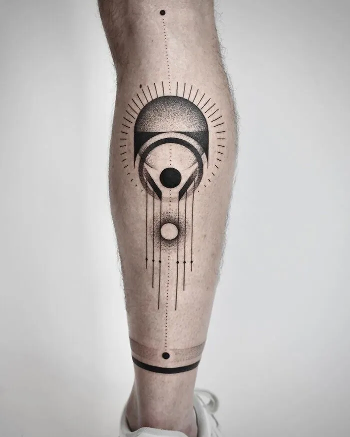 Geometric calf tattoo design with abstract shapes and lines showcasing coolness.