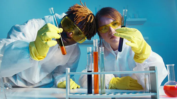 Woman and man doing chemistry