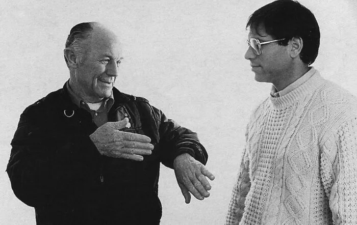 Charles Yeager  explaining something 